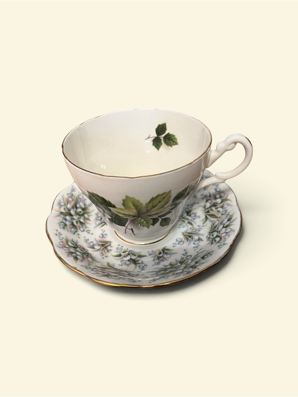 Royal Albert White Teacup and Saucer with Green Leaf and Gold Trim